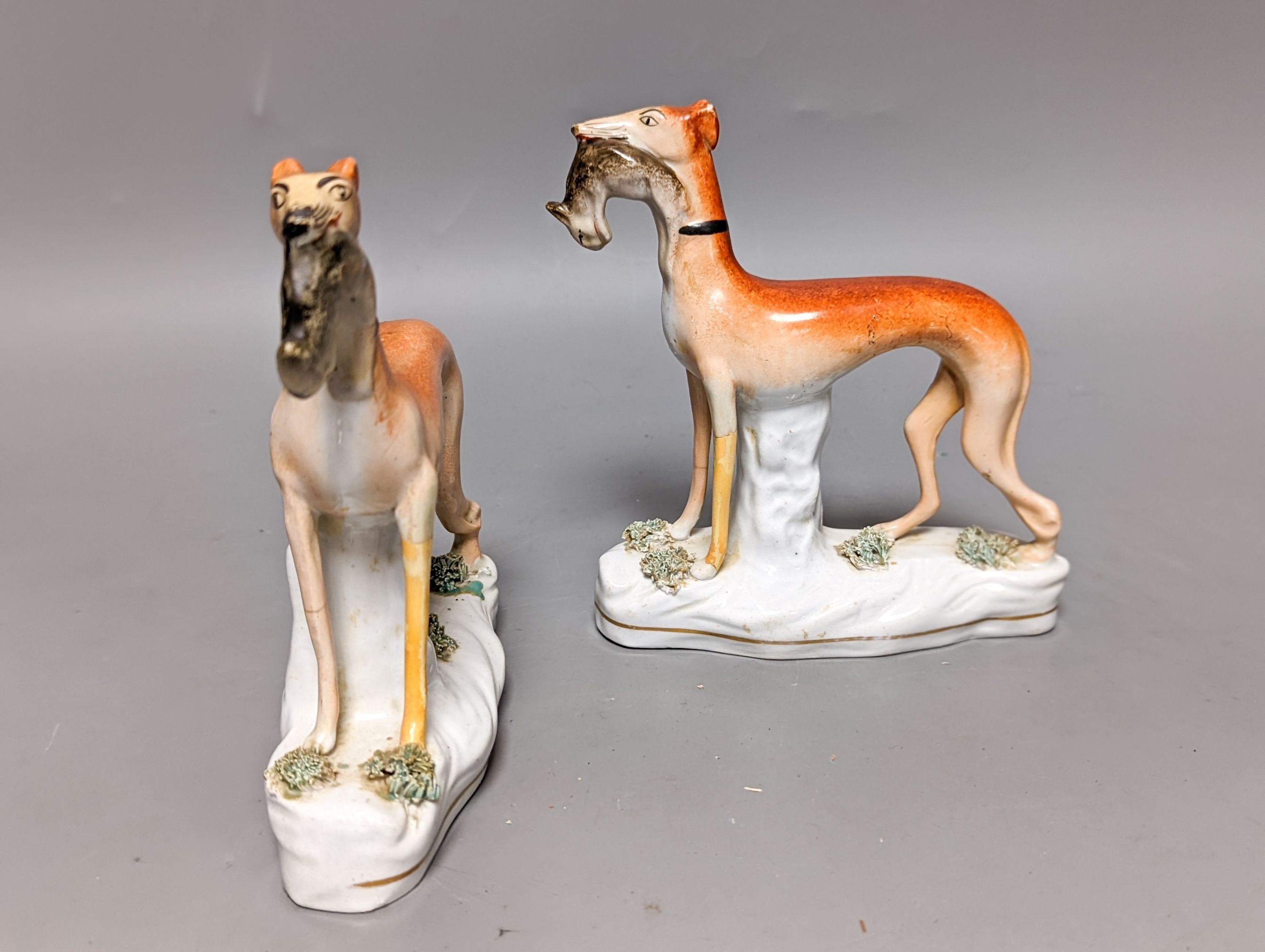 Two pairs of Staffordshire greyhounds, largest 19 cm long